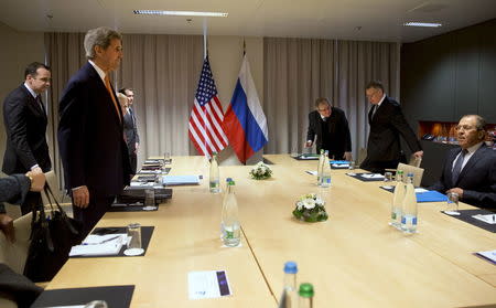 U.S. Secretary of State John Kerry takes his seat across the table from Russian Foreign Minister Sergey Lavrov, for their meeting about Syria, in Zurich, Switzerland, January 20, 2016. REUTERS/Jacquelyn Martin/Pool