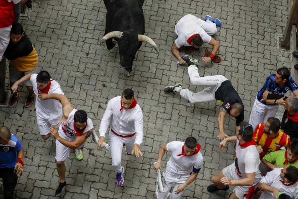 Revellers run with Puerto de San Lorenzo's fighting bulls before entering the bullring during the second day of the San Fermin Running of the Bulls festival on July 7, 2019 in Pamplona, Spain. (Photo: Pablo Blazquez Dominguez/Getty Images)