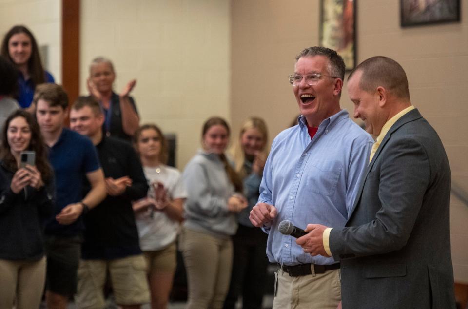 Tim Wilhelmus , center reacts to being annouced the 2023 Vanderburgh County High School Teacher of the Year at Central High School Wednesday morning, April 5, 2023. 