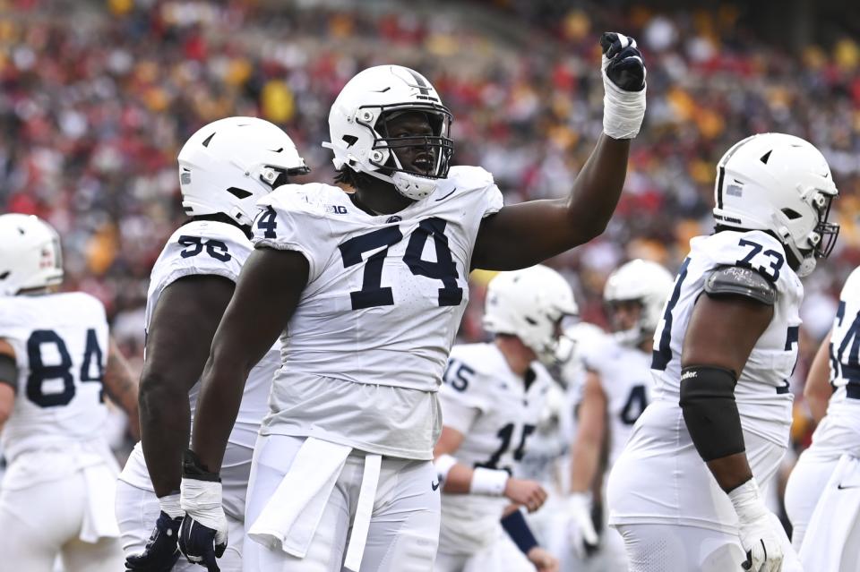 Nov 4, 2023; College Park, Maryland, USA; Penn State Nittany Lions offensive lineman Olumuyiwa Fashanu (74) celebrates after a first half touchdown against the Maryland Terrapins at SECU Stadium. Mandatory Credit: Tommy Gilligan-USA TODAY Sports