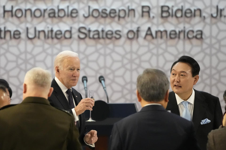FILE - U.S. President Joe Biden, left, and South Korean President Yoon Suk Yeol toast at the start of a state dinner at the National Museum of Korea, in Seoul, South Korea, Saturday, May 21, 2022. Leaked U.S. intelligence documents suggesting that Washington spied on South Korea have put the country’s president in a delicate situation ahead of a state visit to the U.S. (AP Photo/Lee Jin-man, Pool, File)
