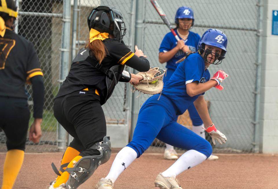 Bear Creek's Hailey Kobler, right, is tagged by  Stagg's Mckenzi "Red" Smith in a run down between third and home during a varsity softball game at Bear Creek in Stockton on Wednesday, May 3, 2023.  Bear Creek won 14-4.