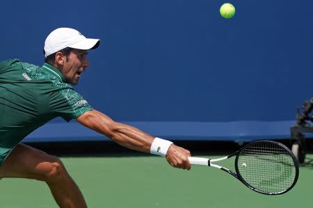 Aug 18, 2018; Mason, OH, USA; Novak Djokovic (SRB) returns a shot against Marin Cilic (CRO) in the Western and Southern tennis open at Lindner Family Tennis Center. Mandatory Credit: Aaron Doster-USA TODAY Sports