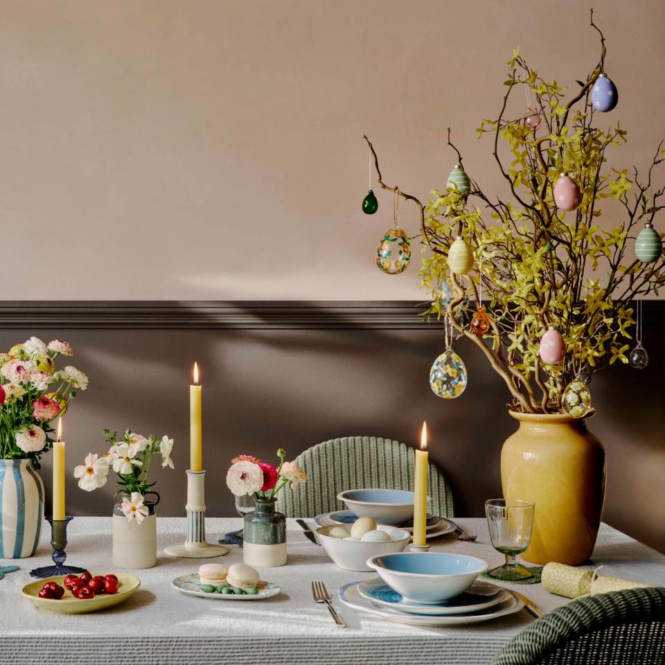An Easter-themed dining tablescape with an Easter tree