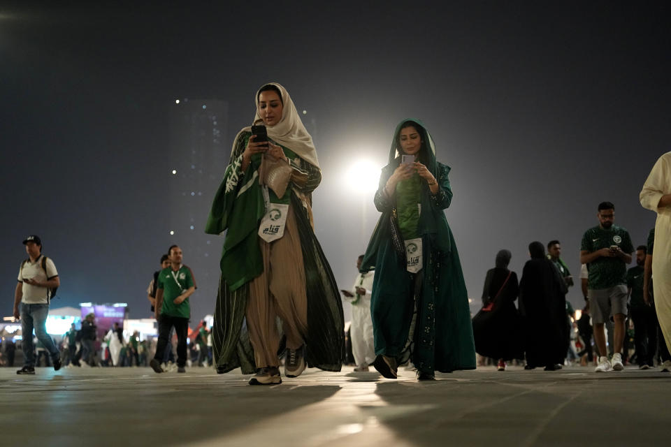 FILE - Supporters arrive at the Lusail Stadium for the World Cup group C soccer match between Saudi Arabia and Mexico, in Lusail, Qatar, Wednesday, Nov. 30, 2022. (AP Photo/Ebrahim Noroozi, File)