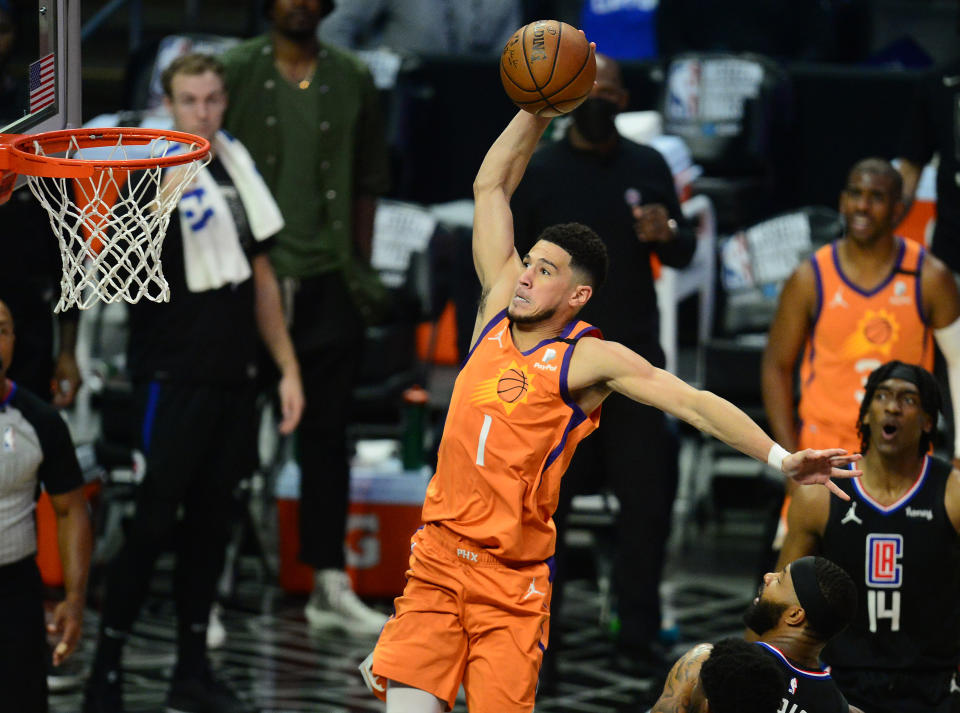 Devin Booker and the Phoenix Suns are soaring toward another title in the Western Conference.  (Gary A. Vasquez/USA Today Sports)