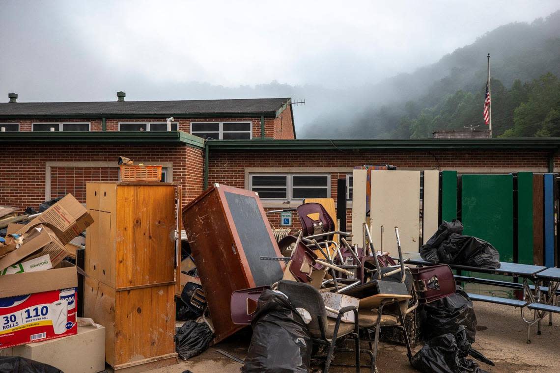 Lunch tables and other school furniture sit outside Hindman Elementary School in Hindman, Ky., on Thursday, Aug. 4, 2022, following flash flooding that devastated the community last week.