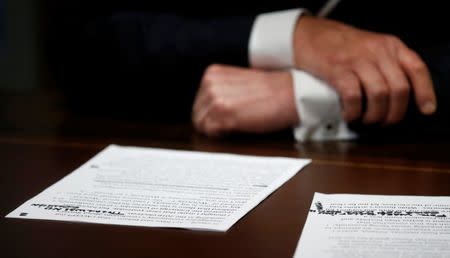 U.S. President Donald Trump's prepared remarks show his own handwritten note "There was no collusion" at the top as he speaks about his summit meeting with Russian President Vladimir Putin at the start of a meeting with members of the U.S. Congress at the White House in Washington, July 17, 2018. REUTERS/Leah Millis