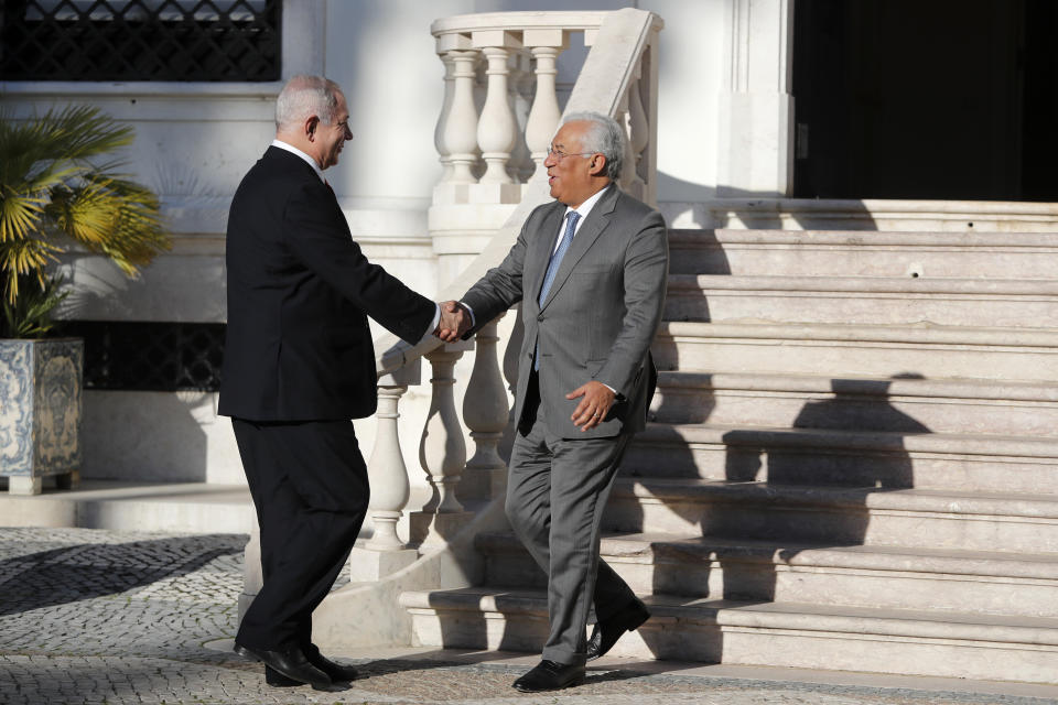 Israeli Prime Minister Benjamin Netanyahu is greeted by Portuguese Prime Minister Antonio Costa, right, as he arrives for their meeting at the Sao Bento palace in Lisbon Thursday, Dec. 5, 2019. (AP Photo/Armando Franca)
