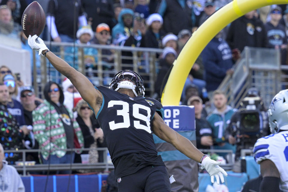 Jacksonville Jaguars wide receiver Jamal Agnew (39) reaches for an incomplete pass during the second half of an NFL football game against the Dallas Cowboys, Sunday, Dec. 18, 2022, in Jacksonville, Fla. (AP Photo/Phelan M. Ebenhack)