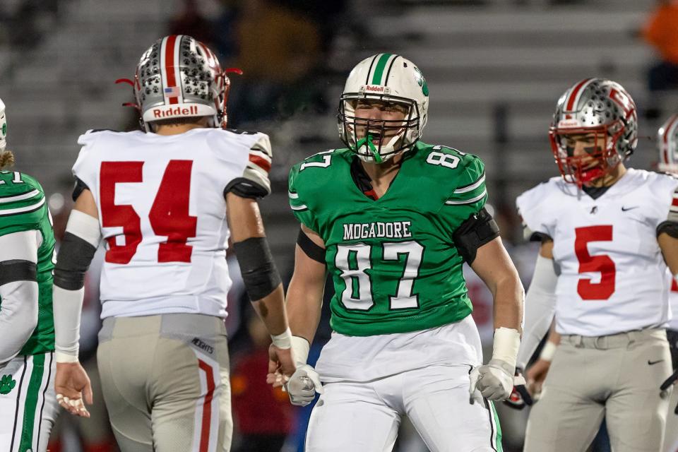 Mogadore senior Mason Williams celebrates after making a tackle behind the line of scrimmage during a regional semifinal against the Cuyahoga Heights, Saturday, Nov. 12 in Twinsburg.