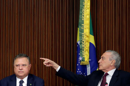 Brazil's President Michel Temer (R) gestures near Brazil's Agriculture Minister Blairo Maggi during a meeting with ambassadors of meat importing countries of Brazil at the Planalto Palace in Brasilia, Brazil March 19, 2017. REUTERS/Ueslei Marcelino