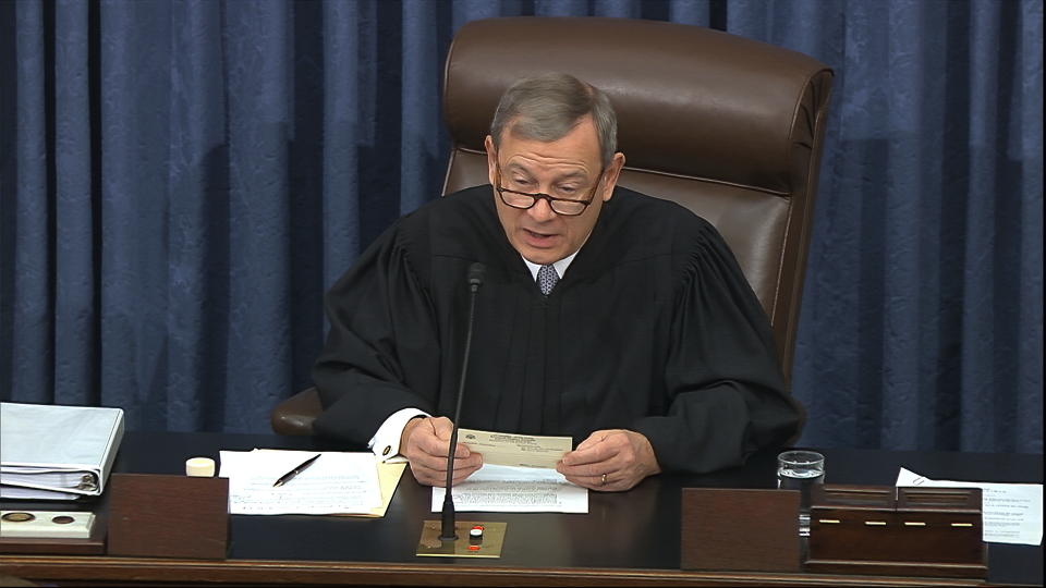 In this image from video, presiding officer Chief Justice of the United States John Roberts reads a question during the impeachment trial against President Donald Trump in the Senate at the U.S. Capitol in Washington, Thursday, Jan. 30 2020. (Senate Television via AP)