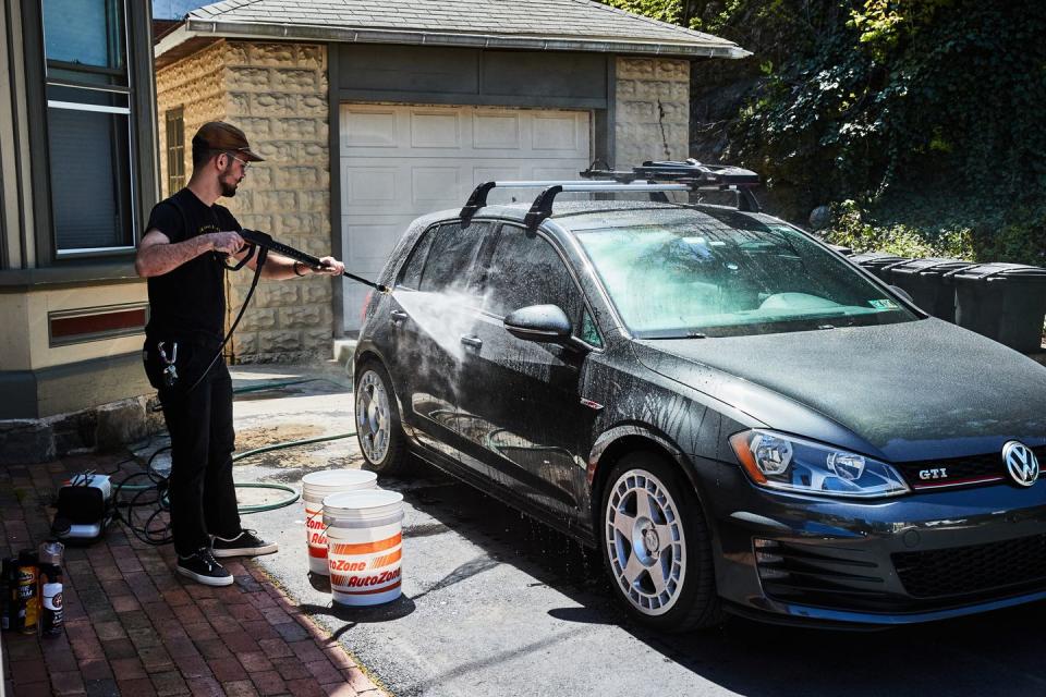 a person standing next to a car