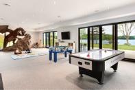 <p>There’s also a games room with air hockey, foosball and a dragon? (Keller Williams Capital Realty) </p>