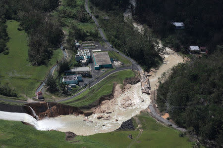 An aerial view shows the damage to the Guajataca dam in the aftermath of Hurricane Maria, in Quebradillas, Puerto Rico September 23, 2017. REUTERS/Alvin Baez