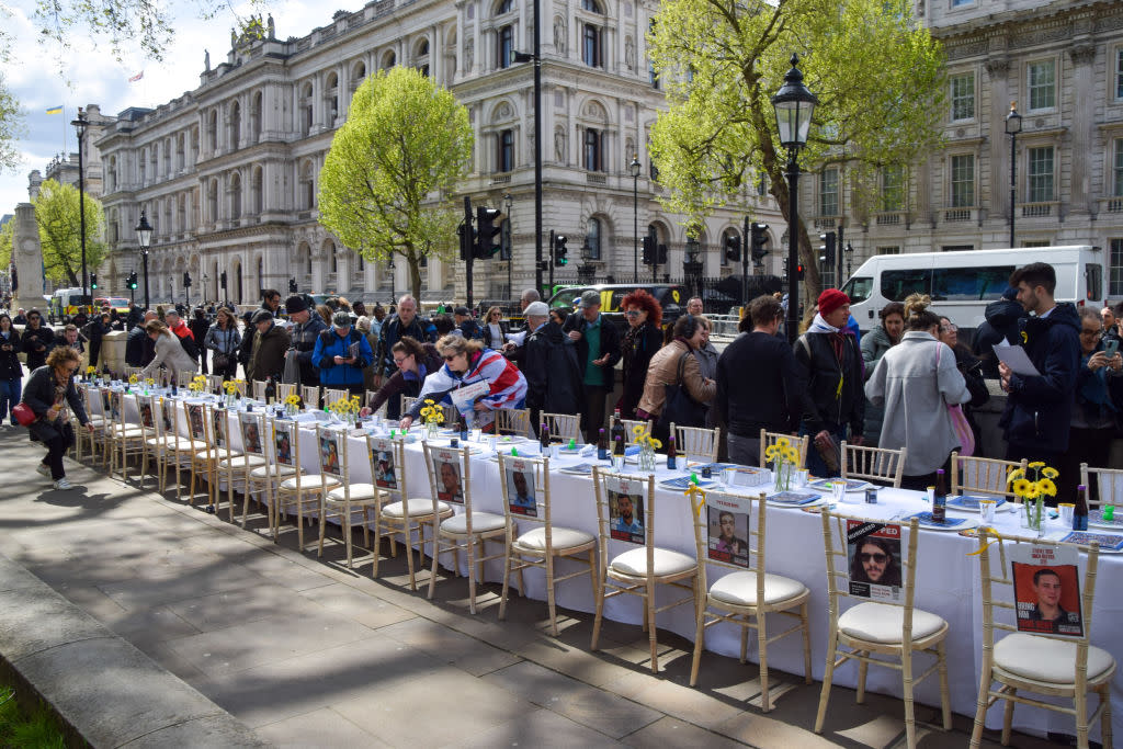 Pro-Israel protesters set up a Passover Seder table opposite Downing Street with 133 empty seats and posters of hostages held by Hamas in Gaza, calling for their release, on April 17, 2024.