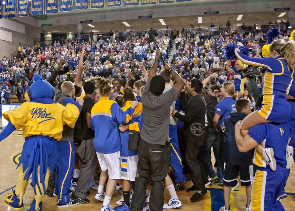 Delaware celebrates its 2011 women's basketball win over Penn State at the Carpenter Center.