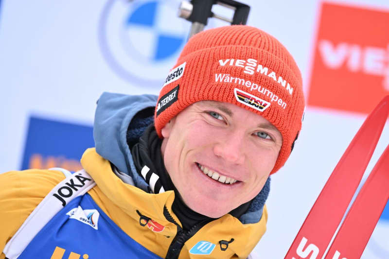 Germany's Benedikt Doll and celebrates after the men's 10 km sprint event of the IBU Biathlon World Cup in Oberhof. Martin Schutt/dpa