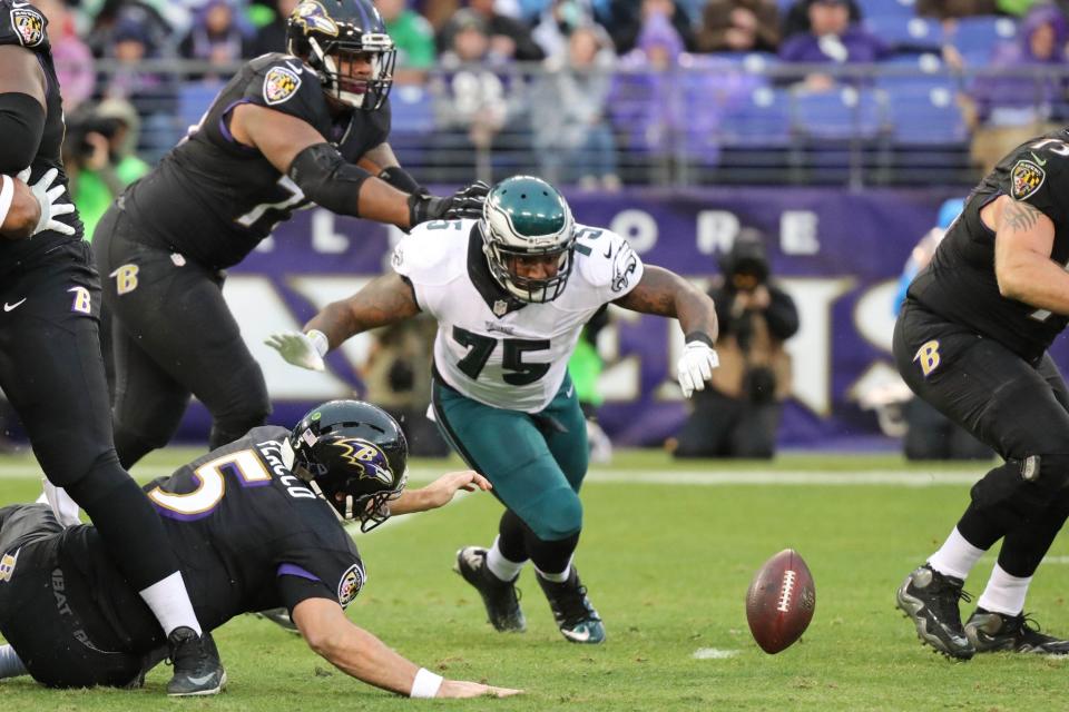 <p>Baltimore Ravens quarterback Joe Flacco (5) fumbles a snap that is recovered by Philadelphia Eagles defensive end Vinny Curry (75) at M&T Bank Stadium. Mandatory Credit: Mitch Stringer-USA TODAY Sports </p>