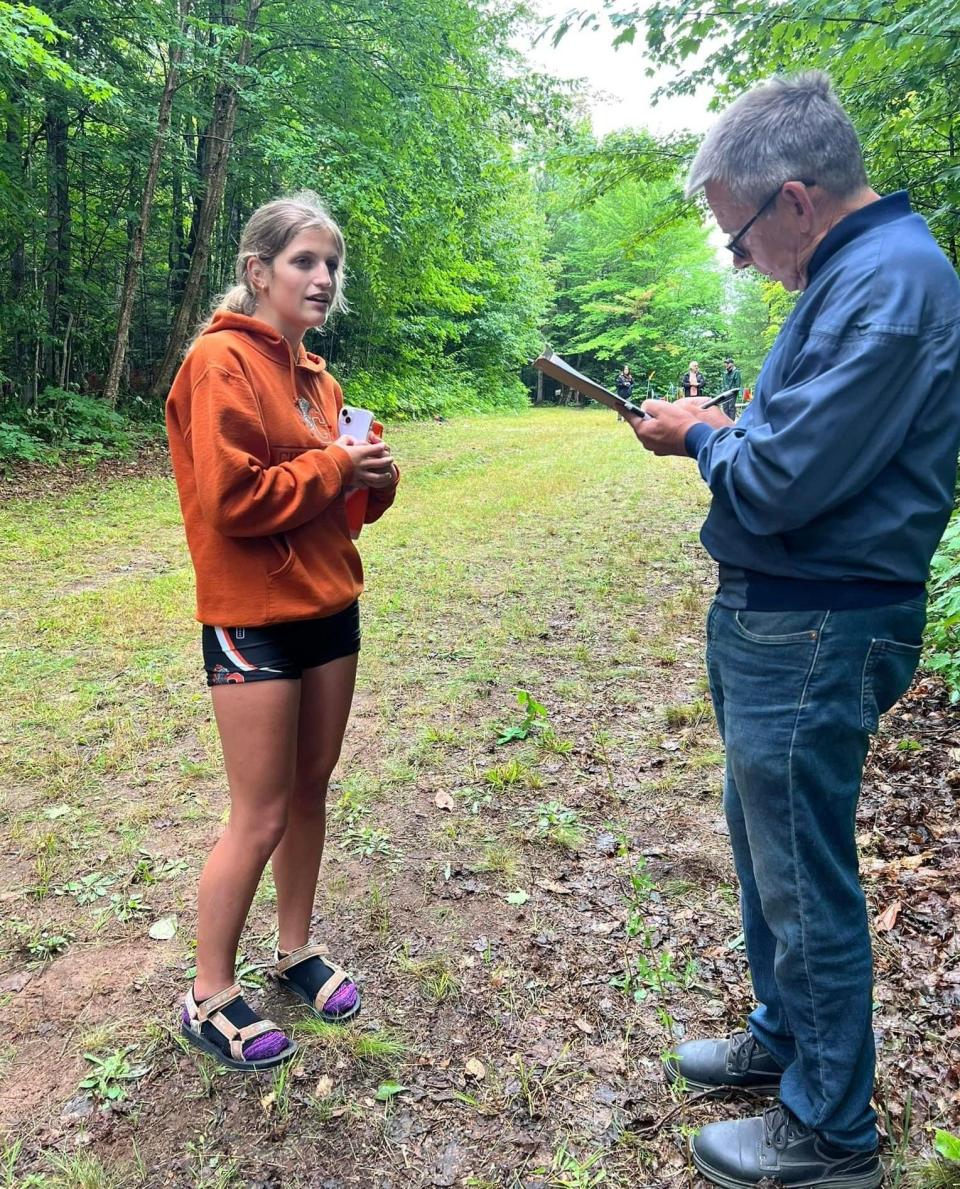 Cheboygan junior cross country runner Sammy Harke talks to a reporter after winning the Larissa Vartti Invitational race in Munising on Tuesday, Aug. 22. The first-place showing for Harke was the first varsity win of her career.