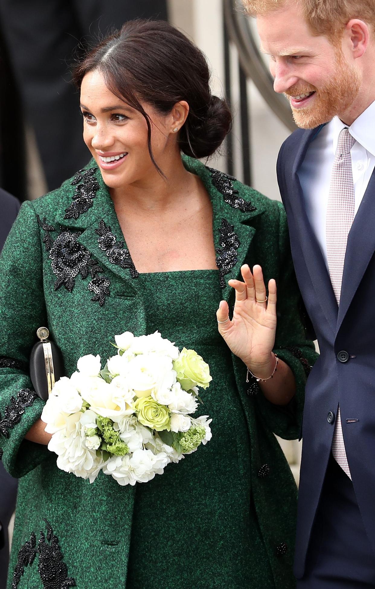 Britain's Prince Harry, Duke of Sussex (R) and Meghan, Duchess of Sussex react as they leave from Canada House, the offices of the High Commission of Canada in the United Kingdom, after attending an event to mark Commonwealth Day, in central London, on March 11, 2019. - Britain's Queen Elizabeth II has been the Head of the Commonwealth throughout her reign. Organised by the Royal Commonwealth Society, the Service is the largest annual inter-faith gathering in the United Kingdom. (Photo by Daniel LEAL-OLIVAS / AFP)        (Photo credit should read DANIEL LEAL-OLIVAS/AFP/Getty Images)