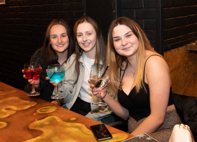 Customers enjoy their first drinks inside the Showtime Bar (Danny Lawson/PA)