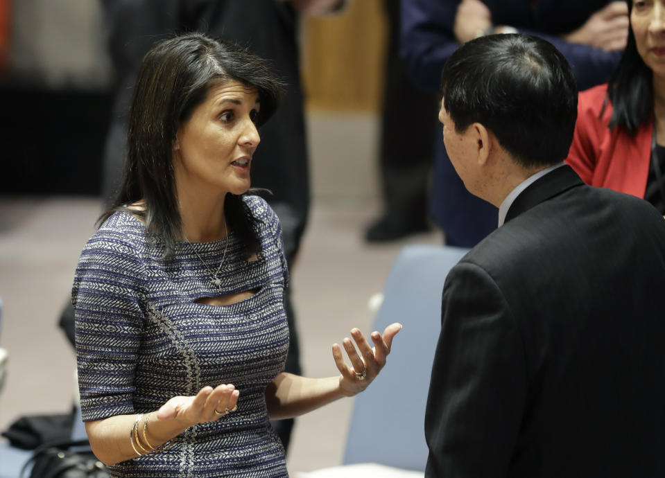 FILE - In this Dec. 22, 2017, file photo, U.S. Ambassador to the United Nations Nikki Haley, talks with Chinese deputy ambassador Wu Haitao, at United Nations headquarters. China supported unprecedentedly harsh sanctions on North Korea that the U.N. Security Council passed in 2016 and 2017, including bans on North Korean exports of coal, textile and seafood, and import caps on fuel and trade bans on vehicles, machinery and “dual-use” technologies that can be used both for civilian and military purposes. (AP Photo/Mark Lennihan, File)