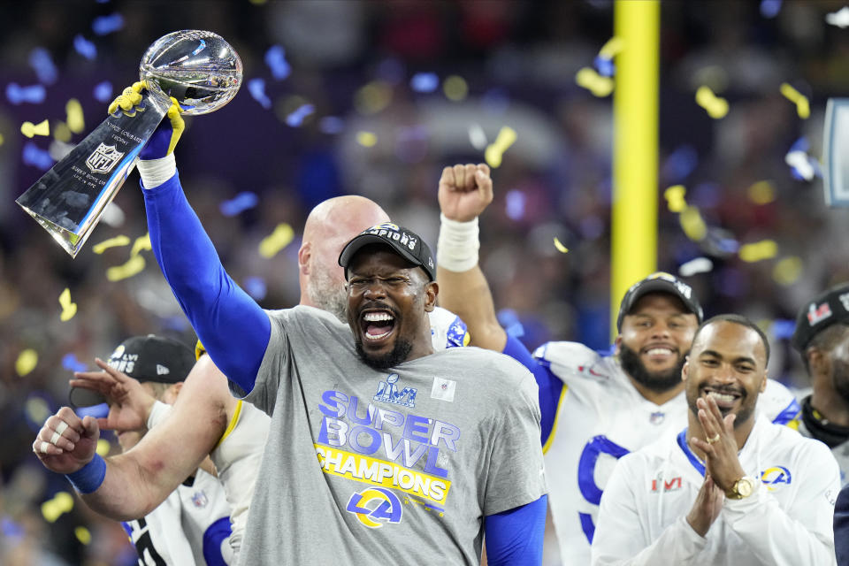 FILE - Los Angeles Rams outside linebacker Von Miller lifts the the Lombardi Trophy after the Rams defeated the Cincinnati Bengals in the NFL Super Bowl 56 football game, Feb. 13, 2022, in Inglewood, Calif. (AP Photo/Chris O'Meara)