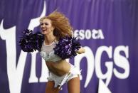 <p>A Minnesota Vikings cheerleader performs during the first half of an NFL football game between the Indianapolis Colts and the Minnesota Vikings Sunday, Dec. 18, 2016, in Minneapolis. (AP Photo/Charlie Neibergall) </p>