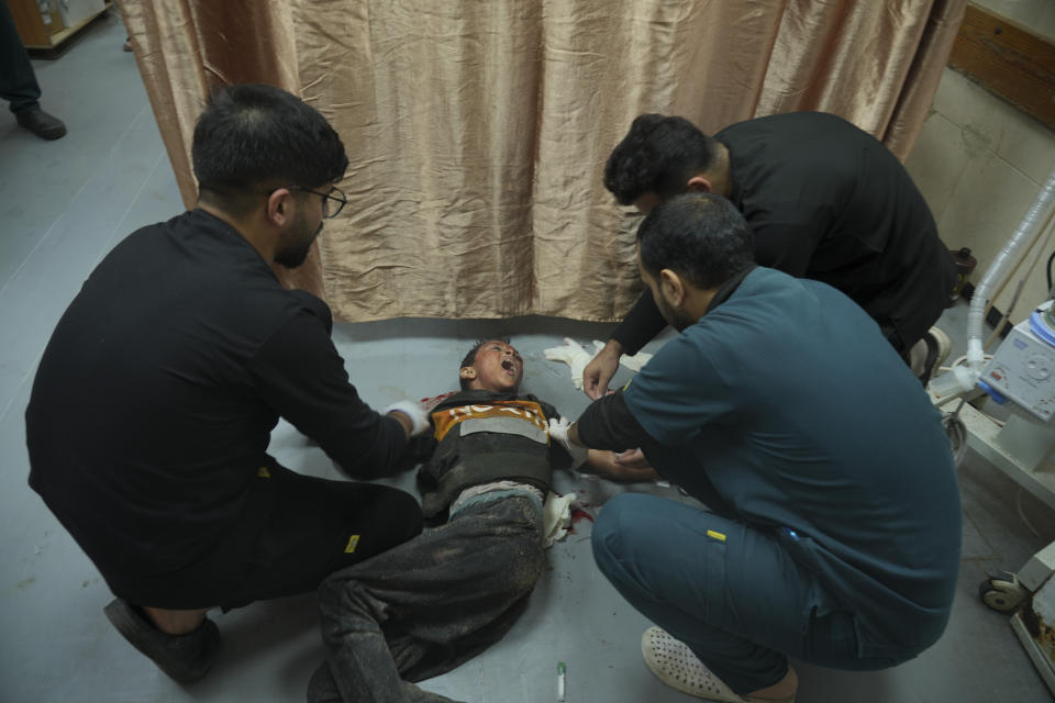 A Palestinian child wounded in Israeli bombardment is treated at the hospital in Deir al Balah on Saturday, Dec. 2, 2023. (AP Photo/ Hatem Moussa)