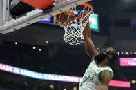 Boston Celtics' Jaylen Brown dunks during the first half of an NBA basketball game against the Milwaukee Bucks, Thursday, March 30, 2023, in Milwaukee. (AP Photo/Aaron Gash)