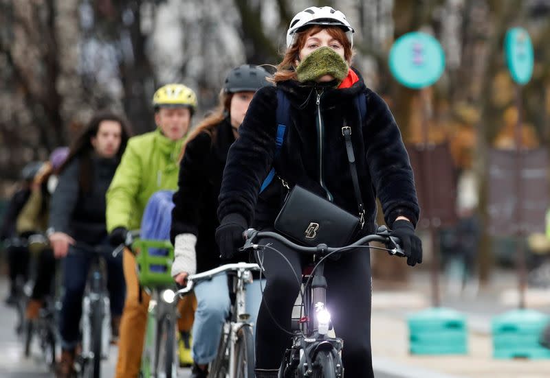 People ride bicycles as a strike by all unions of the Paris transport network (RATP) and French SNCF workers entered its seventh consecutive day in Paris