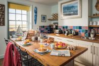 <p>Guests can take their pick of exploring Romney Marsh, dog-friendly Camber Sands and the Medieval town of Rye at lovely two-bedroom holiday home <a href="https://www.petspyjamas.com/travel/location/coastguards-beach-house-east-sussex-tn31-7sh" rel="nofollow noopener" target="_blank" data-ylk="slk:Coastguard's Beach House;elm:context_link;itc:0;sec:content-canvas" class="link ">Coastguard's Beach House</a>. </p><p>Featuring a sociable open-plan layout to help your dog relax, it has a log-burning stove and gorgeous sea views from upstairs, a newly-equipped kitchen and a farmhouse dining table for meals together. </p><p>Pop out for locally sourced ingredients such as seafood and Romney marsh lamb, or if you fancy eating out, there are plenty of great fish and chip shops, charming taverns and restaurants within easy reach.<br></p><p>From £195 per night.</p>