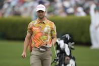 Wyndham Clark works on the practice range during a practice round in preparation for the Masters golf tournament at Augusta National Golf Club Tuesday, April 9, 2024, in Augusta, Ga. (AP Photo/Charlie Riedel)