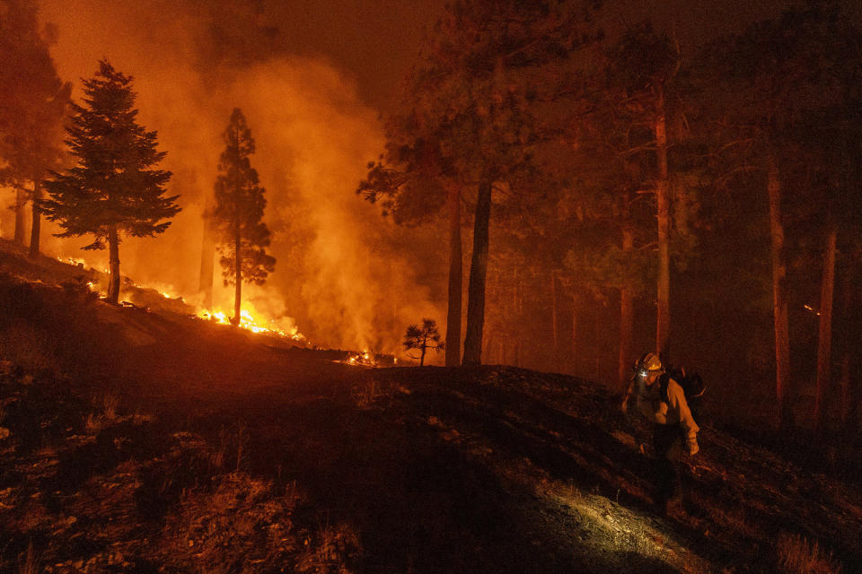 Image: Fire on bridge in California, smoke at night (Etienne Laurent / AFP - Getty Images)