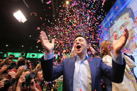 Ukrainian presidential candidate Volodymyr Zelenskiy reacts following the announcement of the first exit poll in a presidential election at his campaign headquarters in Kiev, Ukraine April 21, 2019. REUTERS/Stringer