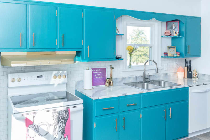 Renovated white kitchen with light turquoise cabinets