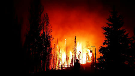 Smoke rises from a wildfire as seen from Bondurant, Wyoming, United States in this September 22, 2018 photo by Bryce Harvey. Bryce Harvey/Social Media/via REUTERS