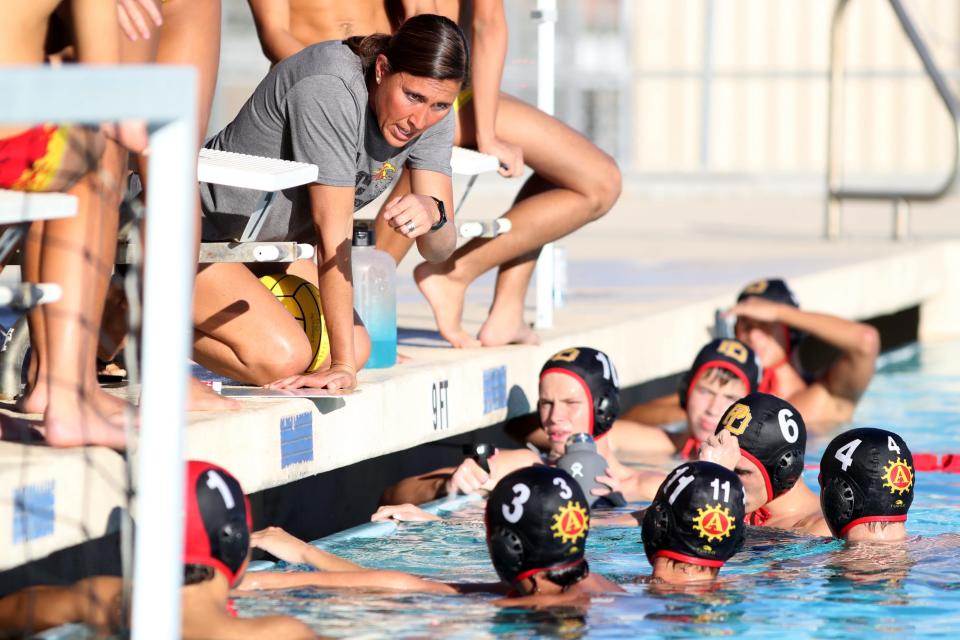 Palm Desert High School water polo head coach Michelle Valovic coaches the players against Northwood of Irvine in their CIF-SS Division 2 round one playoff game in Palm Desert, Calif., on Tuesday, Oct. 31, 2023.