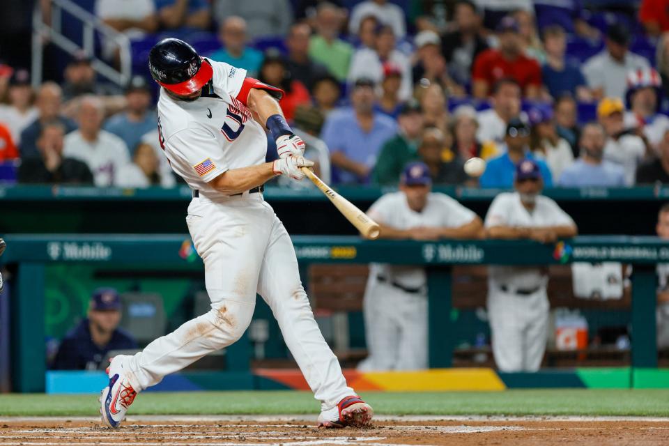 Former Diamondbacks player Paul Goldschmidt hits a two-run home run for the United States during the first inning against Cuba.