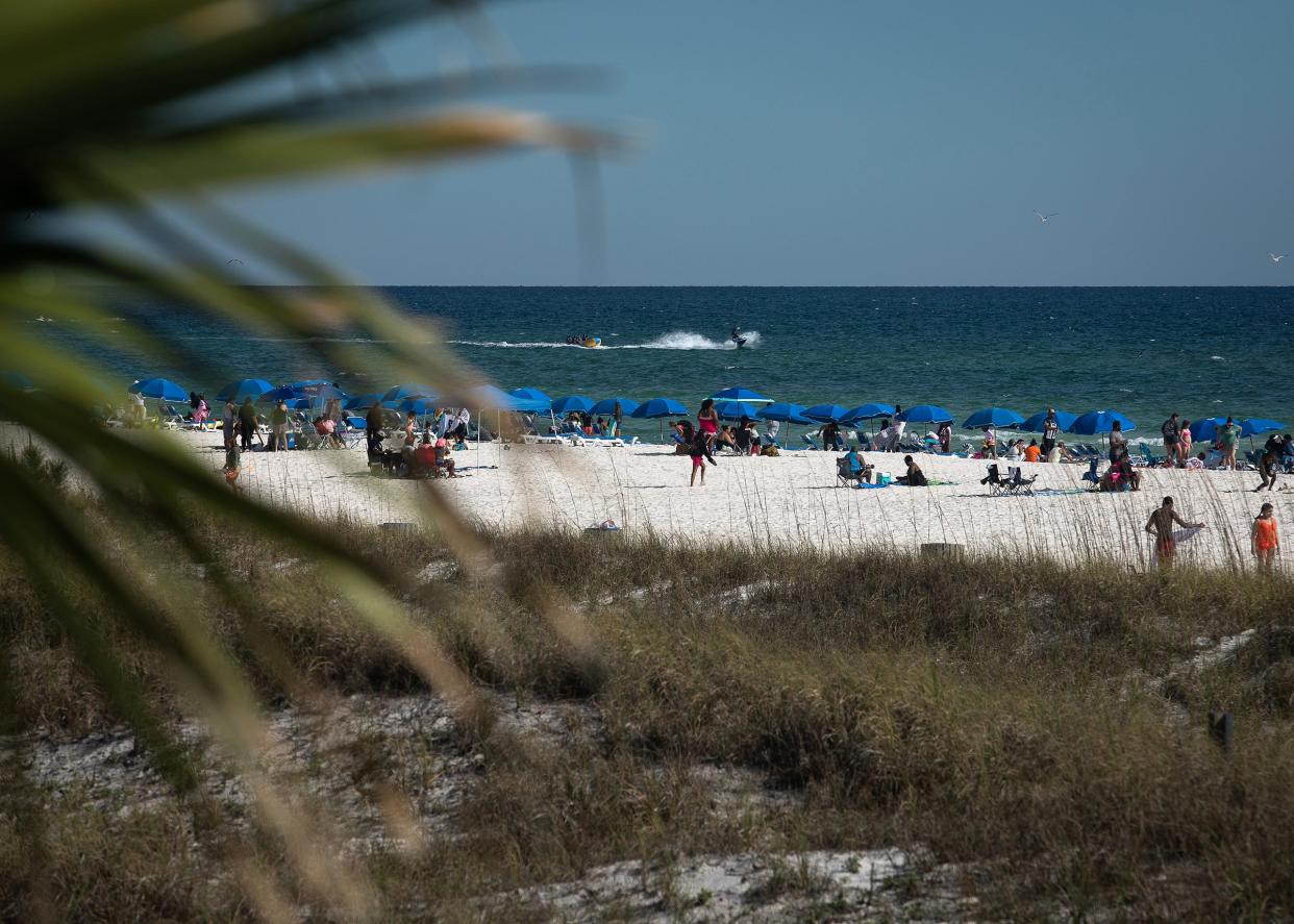 Beachgoers at the M.B. Miller County Pier in Panama City Beach.