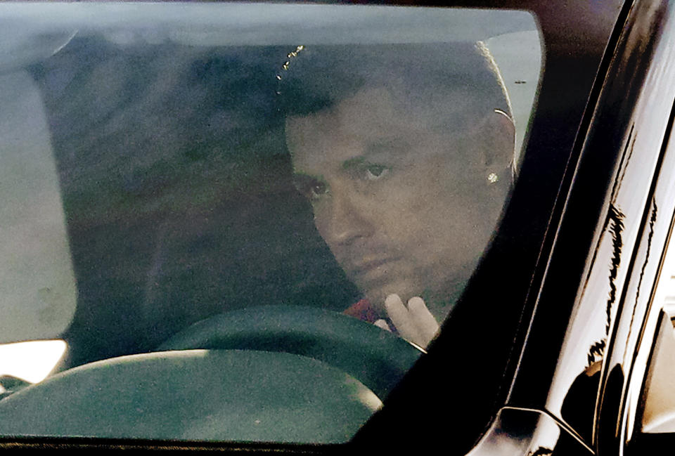 Juventus' Cristiano Ronaldo waves to supporters and drives his car as he arrives for a training session at the Continassa Juventus center, in Turin, Italy, Friday, Jan. 11, 2019. Las Vegas police say investigators are asking Italian authorities to obtain a DNA sample from Cristiano Ronaldo in an ongoing rape investigation. (AP Photo/Luca Bruno)