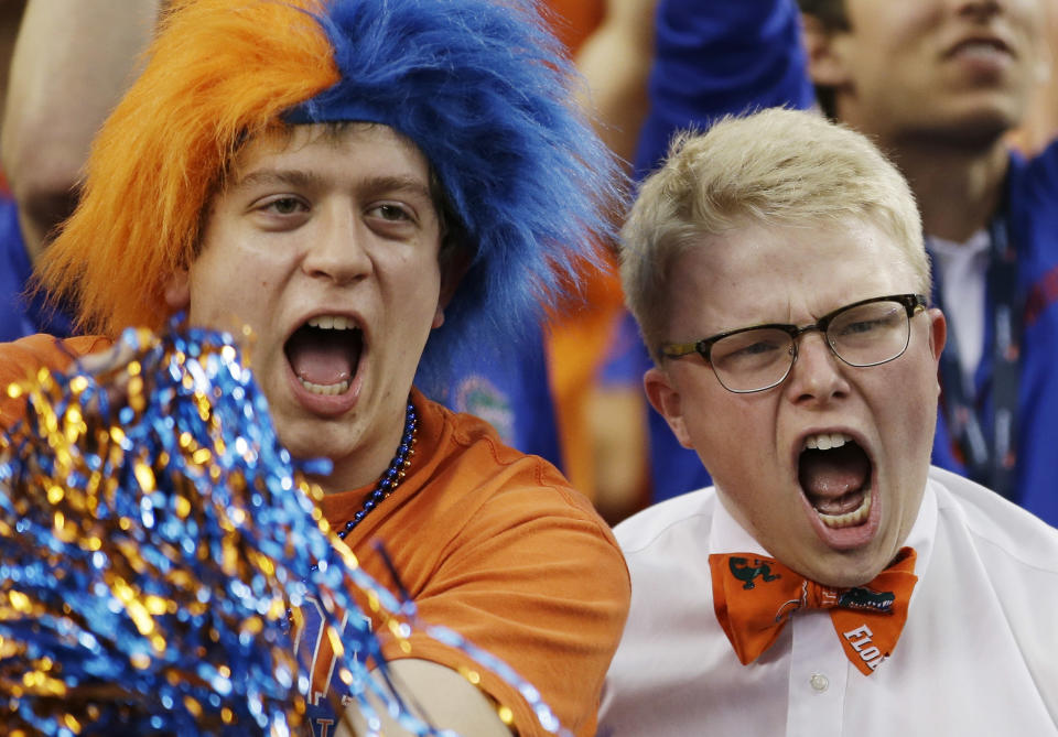 Florida fans cheer before an NCAA Final Four tournament college basketball semifinal game against Connecticut Saturday, April 5, 2014, in Arlington, Texas. (AP Photo/David J. Phillip)