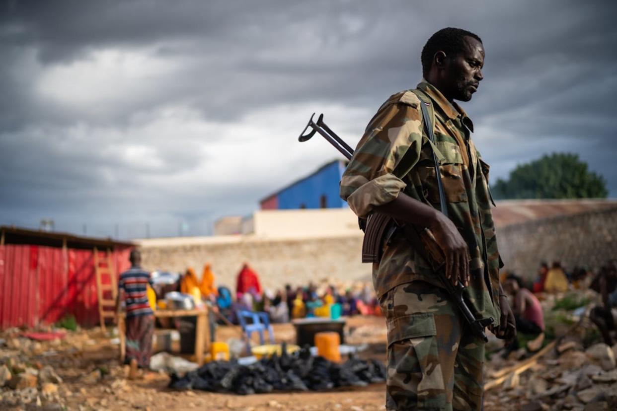 A soldier stands guard at a makeshift camp in Somalia's Baidoa, a southwestern town frequently attacked by Al-Shabaab militants. Shutterstock