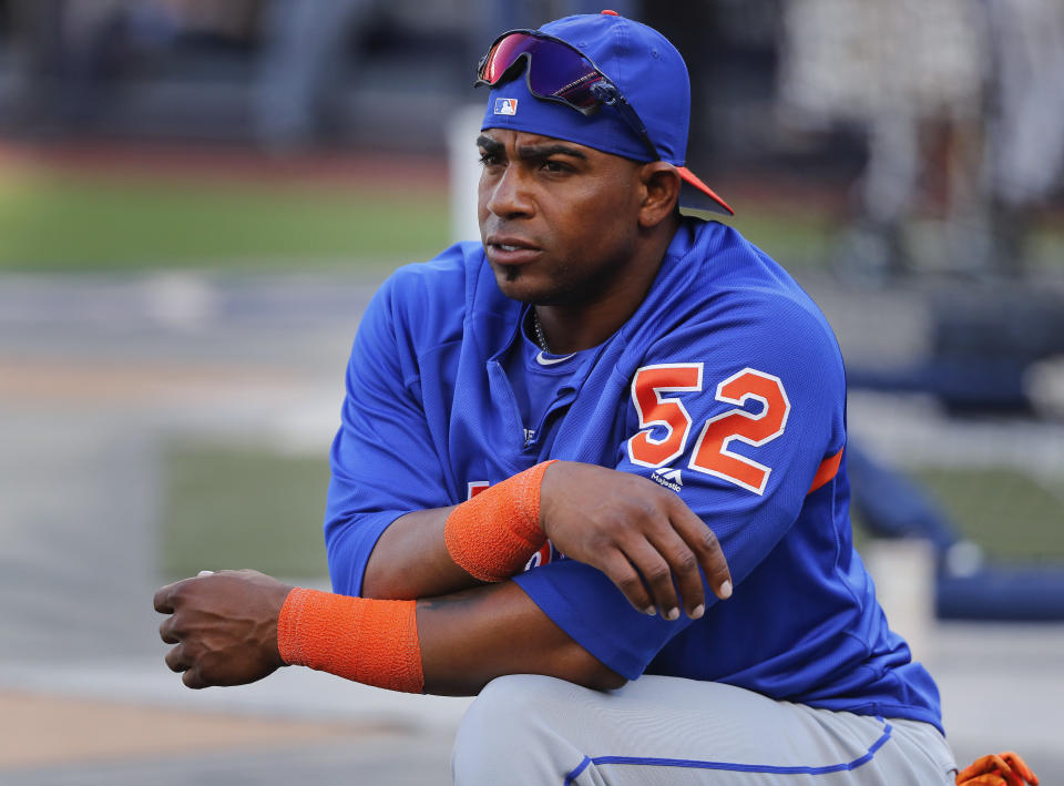 FILE - In this July 20, 2018, file photo, New York Mets' Yoenis Cespedes stretches before the team's baseball game against the New York Yankees in New York. Cespedes is back on the disabled list, and the Mets are still deciding whether the oft-injured slugger needs surgery on both feet that would require an eight-to-10-month recovery. (AP Photo/Julie Jacobson, File)