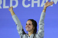 Regan Smith of the United States waves from the podium after winning the Women 100m Backstroke final at the 19th FINA World Championships in Budapest, Hungary, Monday, June 20, 2022. (AP Photo/Petr David Josek)