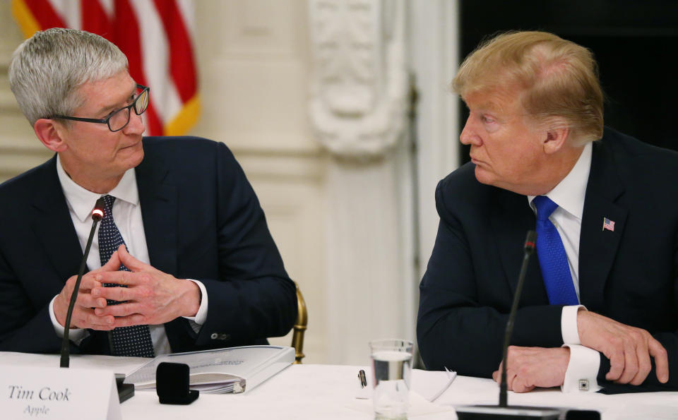 Apple CEO Tim Cook speaks as he and U.S. President Donald Trump participate in an American Workforce Policy Advisory Board meeting in the White House State Dining Room in Washington, U.S., March 6, 2019. REUTERS/Leah Millis?