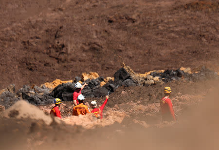 Members of a rescue team search for victims after a tailings dam owned by Brazilian mining company Vale SA collapsed, in Brumadinho, Brazil January 30, 2019. REUTERS/Adriano Machado