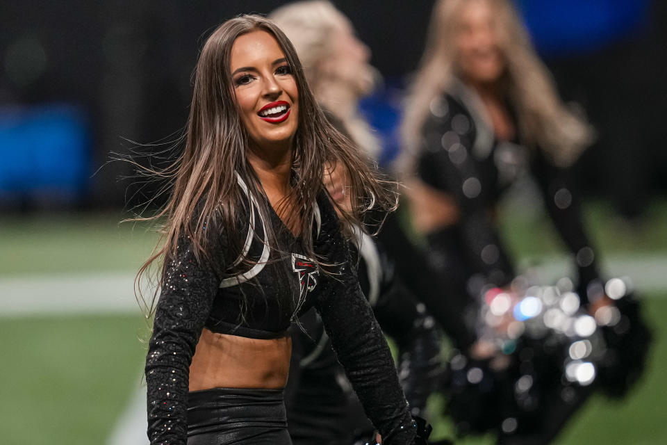 Nov 26, 2023; Atlanta, Georgia, USA; An Atlanta Falcons cheerleader on the field against the New Orleans Saints at Mercedes-Benz Stadium. Mandatory Credit: Dale Zanine-USA TODAY Sports